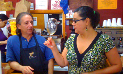 at the wine shoppe in miami. Ozzy and colleague
          with a very serious tool for assessing white
          wines. riq is available chilled in the cooler.
          don't miss the coffee